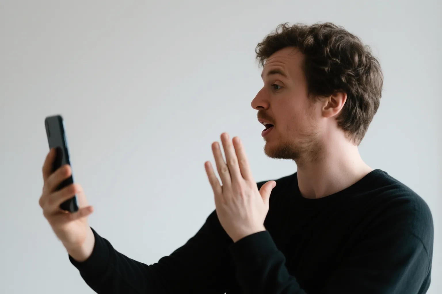 Person practicing Spanish 'no' phrases with a Langel on phone